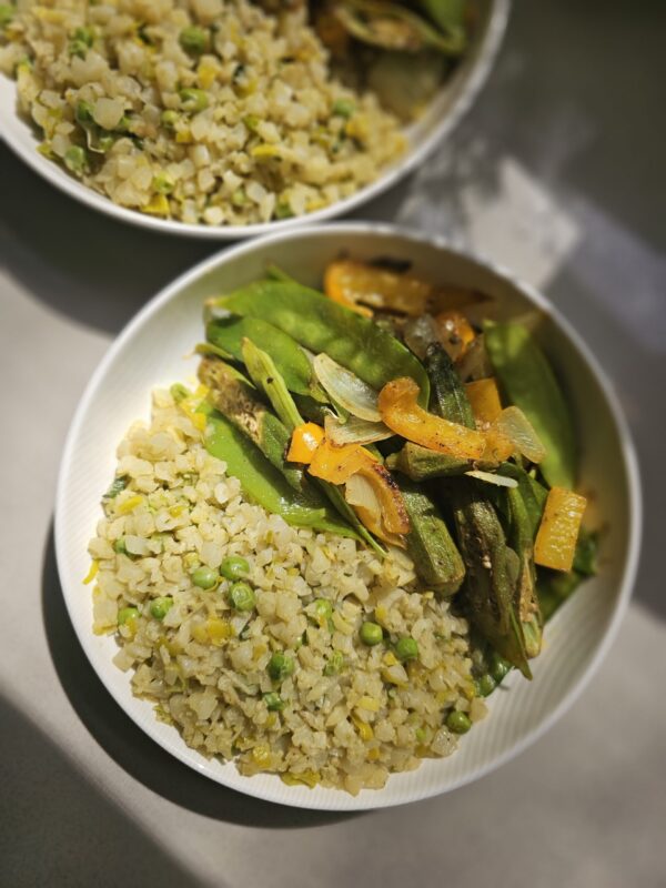 Participants in J.chefé’s Virtual Vegan Cooking Class, engaged in plant-based culinary exploration, showcasing ingredients and cooking techniques.